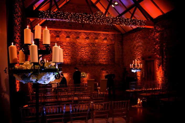 Notley Abbey wedding event lighting - uplighting, fairylight canopy, draping, chandaliers