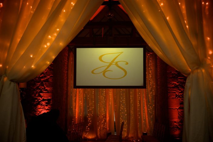 Notley Abbey wedding event lighting - uplighting, fairylight canopy, draping, chandaliers