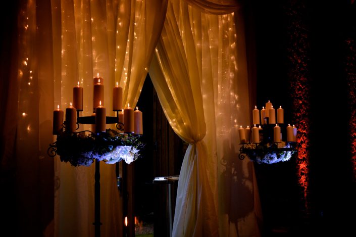 Notley Abbey wedding event lighting - uplighting, fairylight canopy, draping, chandaliers