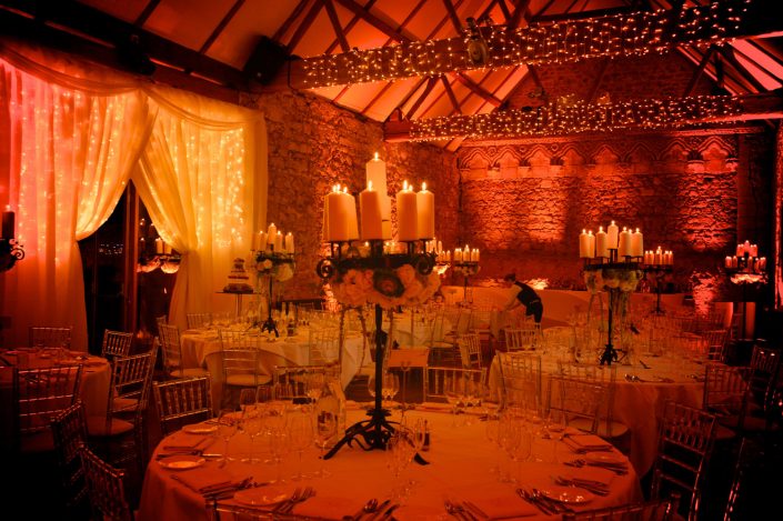 Notley Abbey wedding event lighting - uplighting, fairylight canopy, draping, chandaliers