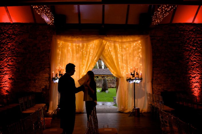 Notley Abbey wedding event lighting - uplighting, fairylight canopy, draping, chandaliers