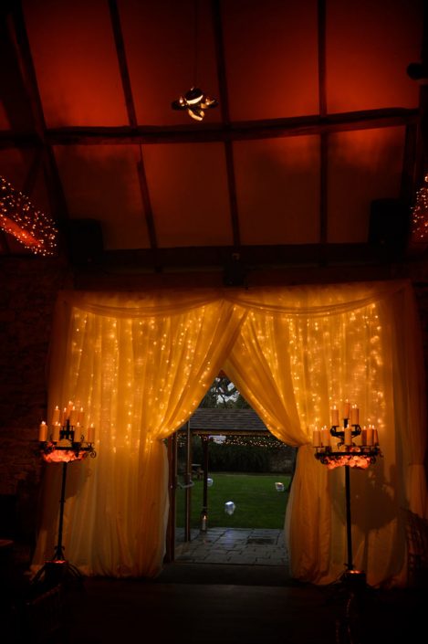 Notley Abbey wedding event lighting - uplighting, fairylight canopy, draping, chandaliers