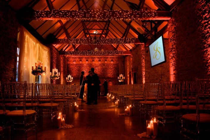 Notley Abbey wedding event lighting - uplighting, fairylight canopy, draping, chandaliers