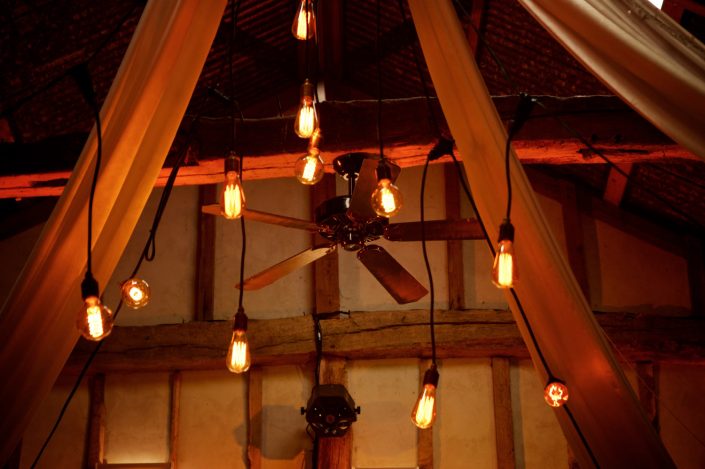 Alpheton Hall Barn wedding party lighting, festoon, fairylights, candles, draping